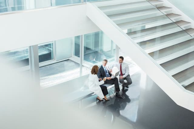 Three executives having a conversation