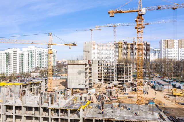 Construction site with cranes - 1200x799