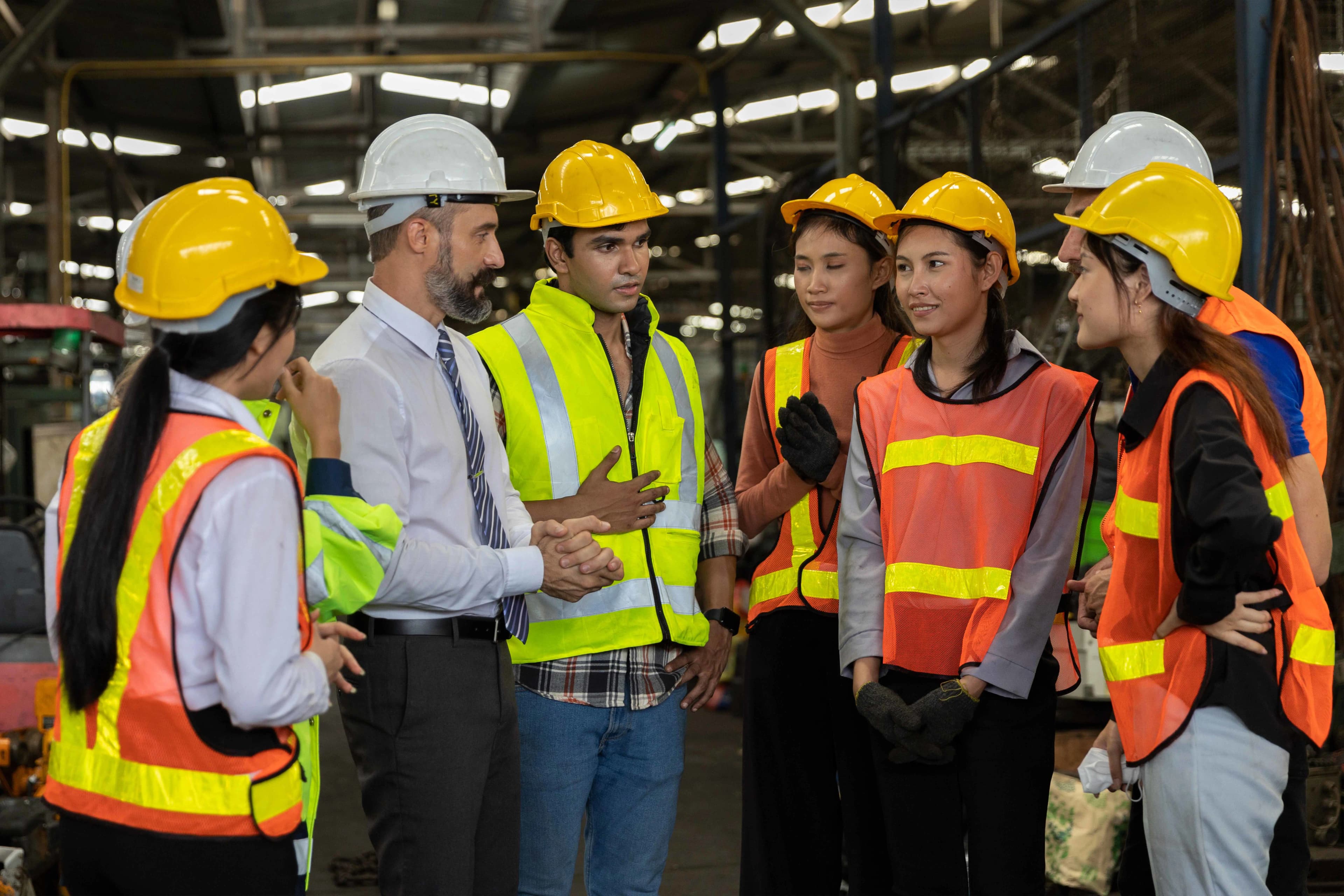 Seven construction workers talking