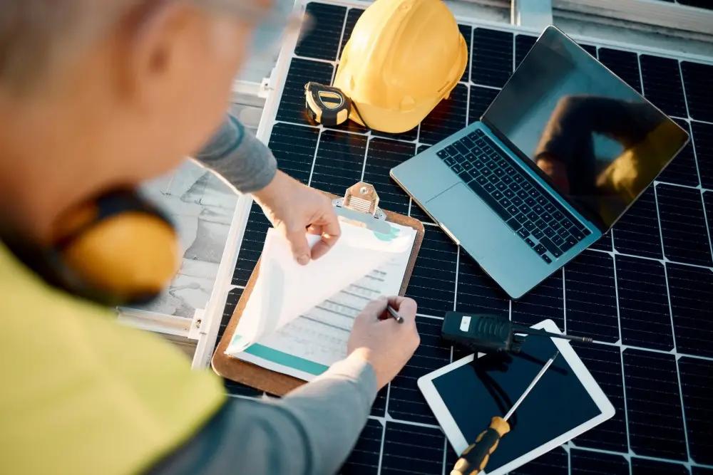 Overhead shot of a construction worker looking at a document